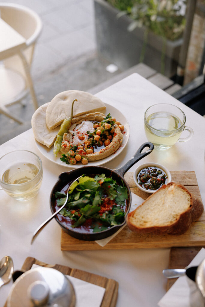 Things to do in Bloomsbury - Visit Honey & Co for delicious hummus, shakshuka and hallah bread